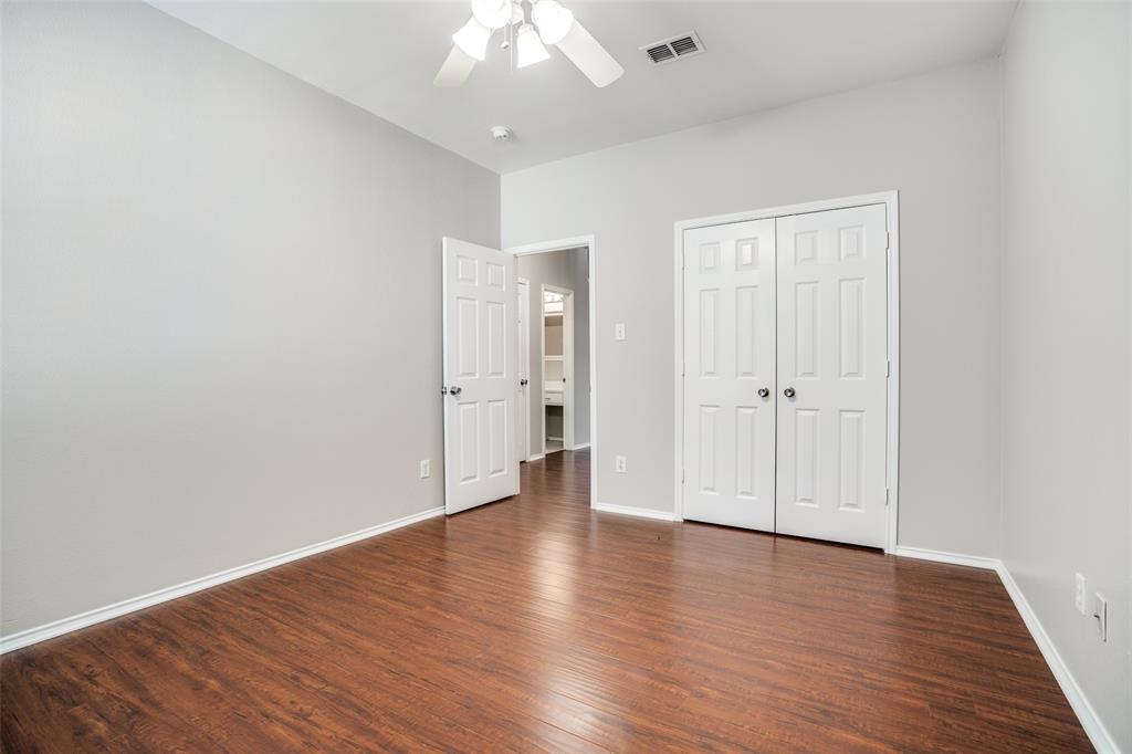 8308 Ram Ridge Road Fort Worth, TX 76137 - Photo 21 of 24 a view of an empty room with wooden floor