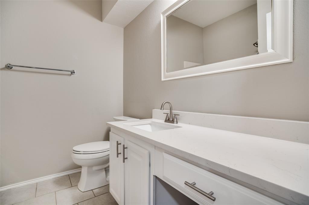 8308 Ram Ridge Road Fort Worth, TX 76137 - Photo 23 of 24 a bathroom with a sink and a toilet