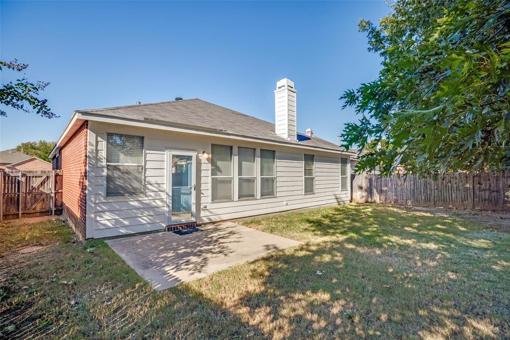 8308 Ram Ridge Road Fort Worth, TX 76137 - Photo 24 of 24 a front view of a house with a garden and yard