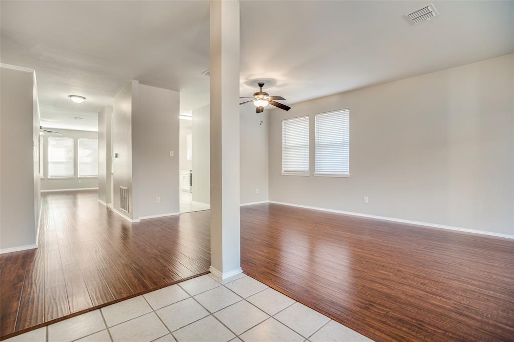 8308 Ram Ridge Road Fort Worth, TX 76137 - Photo 5 of 24 wooden floor in an empty room with a window