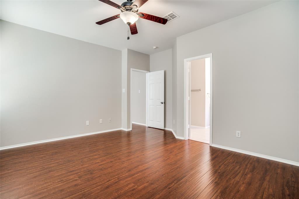 8308 Ram Ridge Road Fort Worth, TX 76137 - Photo 6 of 24 an empty room with wooden floor and windows