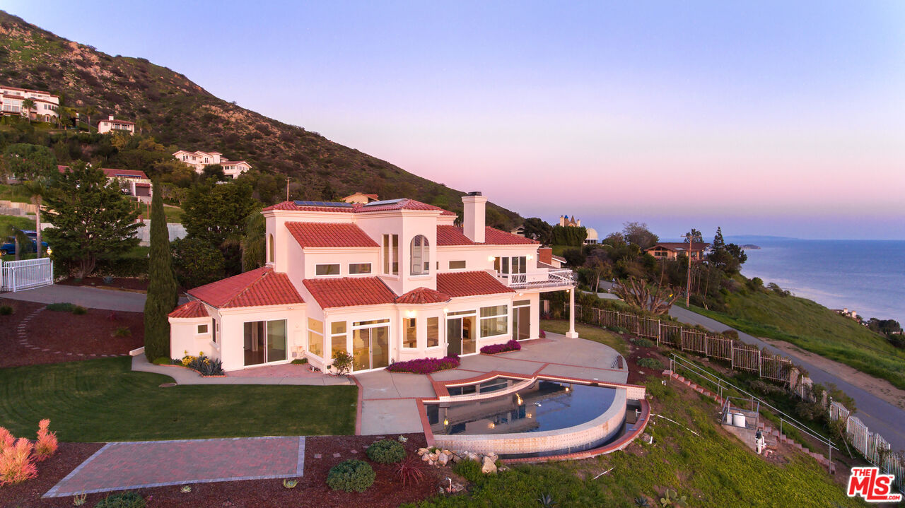 a view of a large building with a big yard