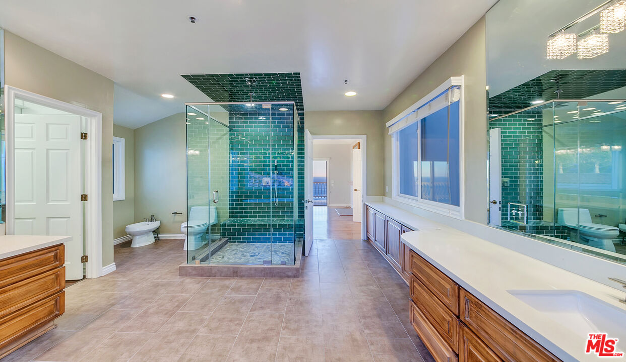 4237 Avenida De La Encinal Malibu, CA 90265 - Photo 21 of 24 a bathroom with a double vanity sink and toilet