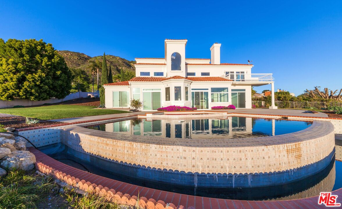4237 Avenida De La Encinal Malibu, CA 90265 - Photo 23 of 24 a view of a house with a swimming pool