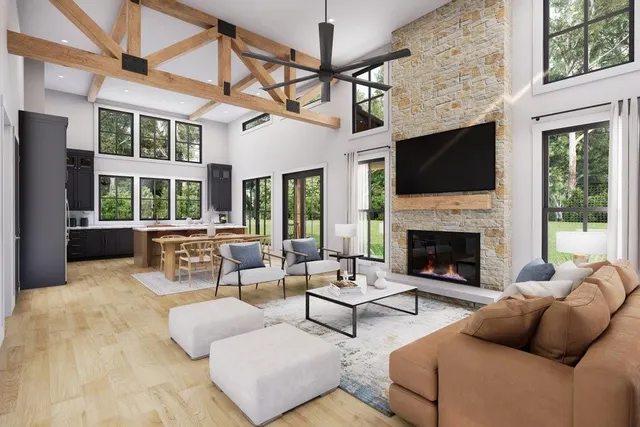 a living room with furniture large window and flat screen tv