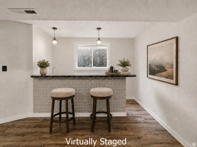 2693 Teal Way Sandy, UT 84093 - Photo 25 of 50 Built-in bar with stone-look countertop, integrated sink, and pendant lighting