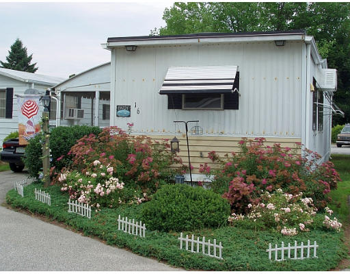 239 Ayer Road, Unit 16 Littleton, MA 01460 - Photo 1 of 1 a front view of a house with garden