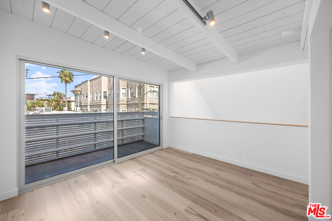 21 1/2 Wavecrest Avenue Venice, CA 90291 - Photo 21 of 29 wooden floor in an empty room with a window