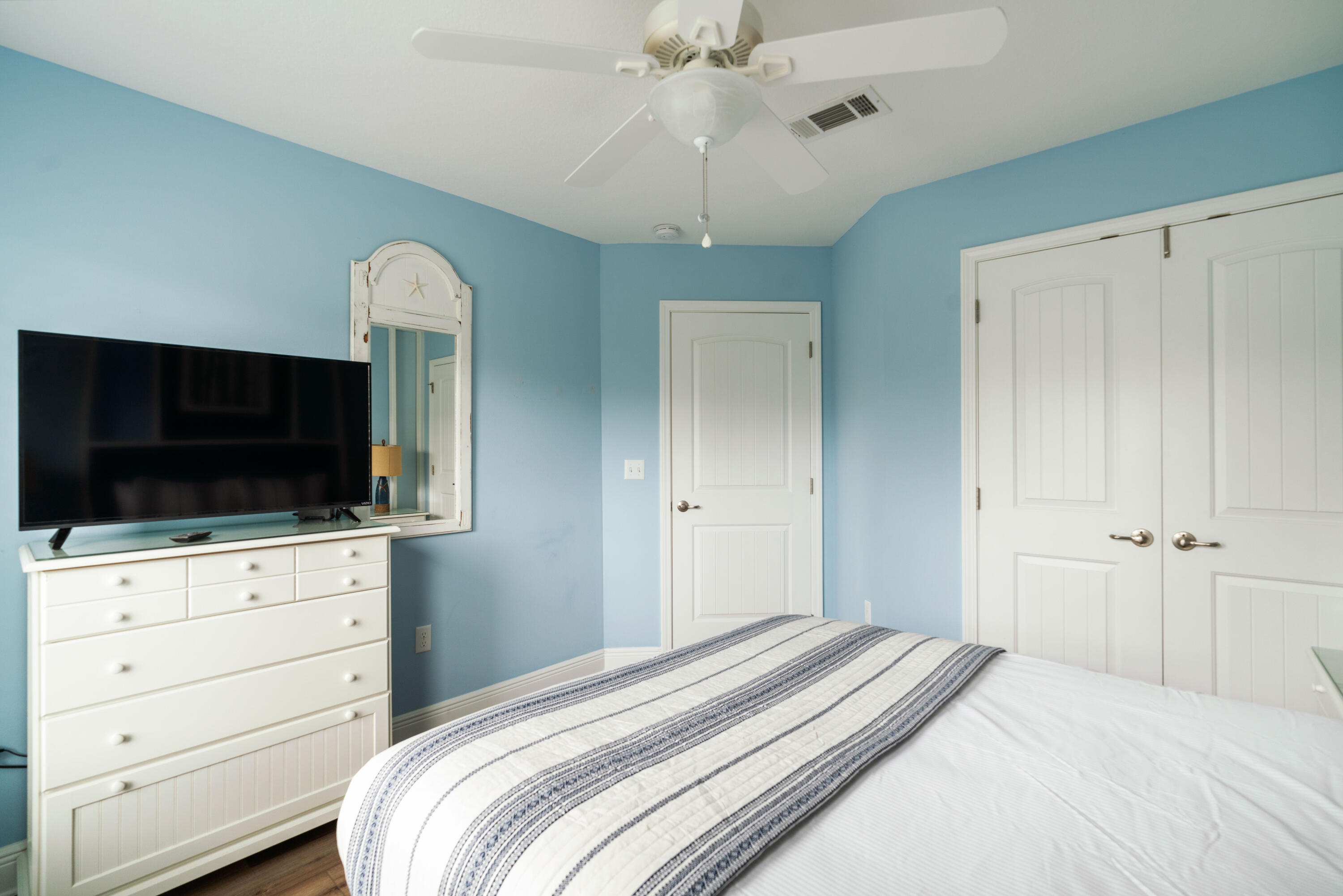 104 Sandpine Loop Inlet Beach, FL 32461 - Photo 18 of 26 a bedroom with a bed and a flat screen tv