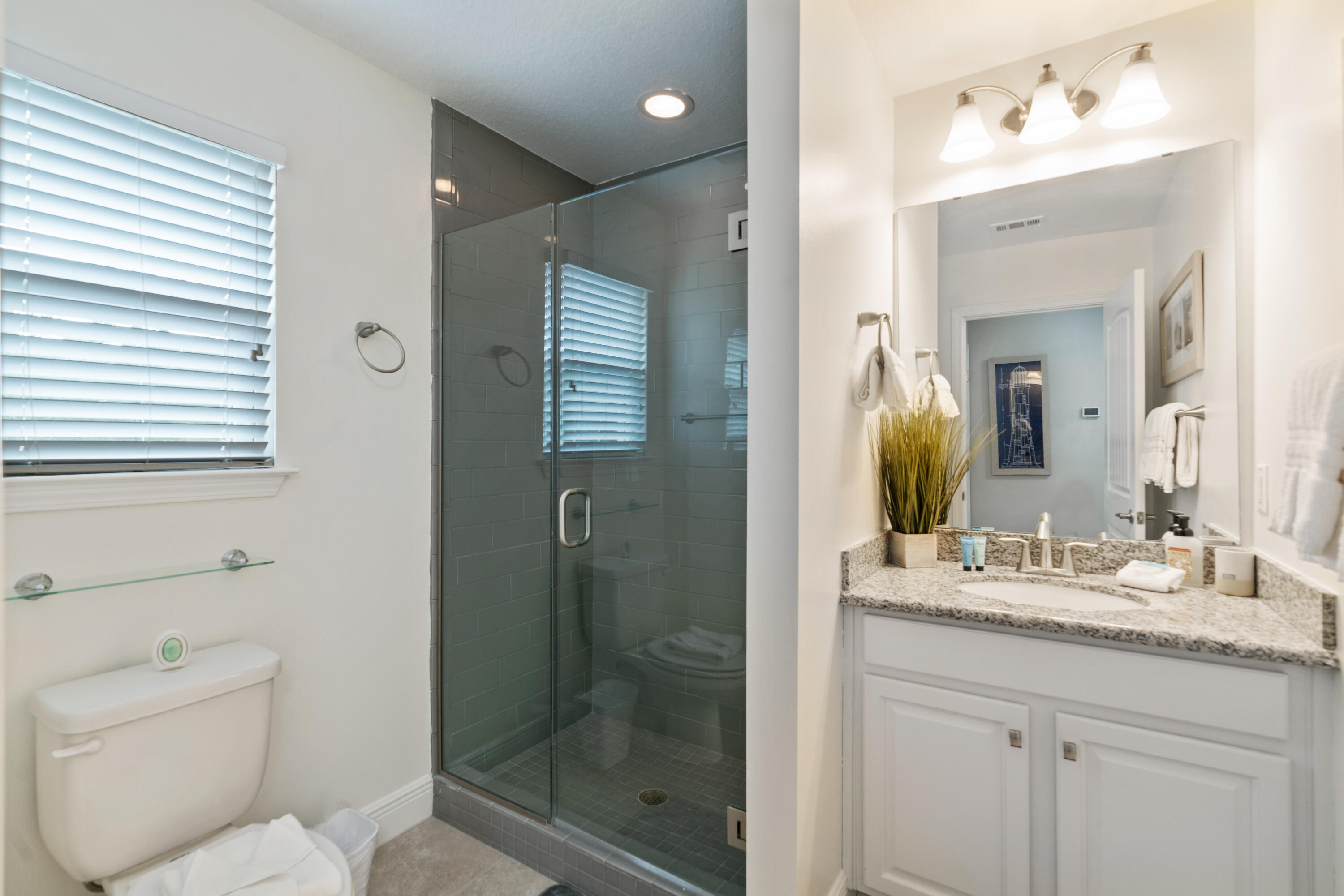 104 Sandpine Loop Inlet Beach, FL 32461 - Photo 19 of 26 a bathroom with a sink a toilet and shower