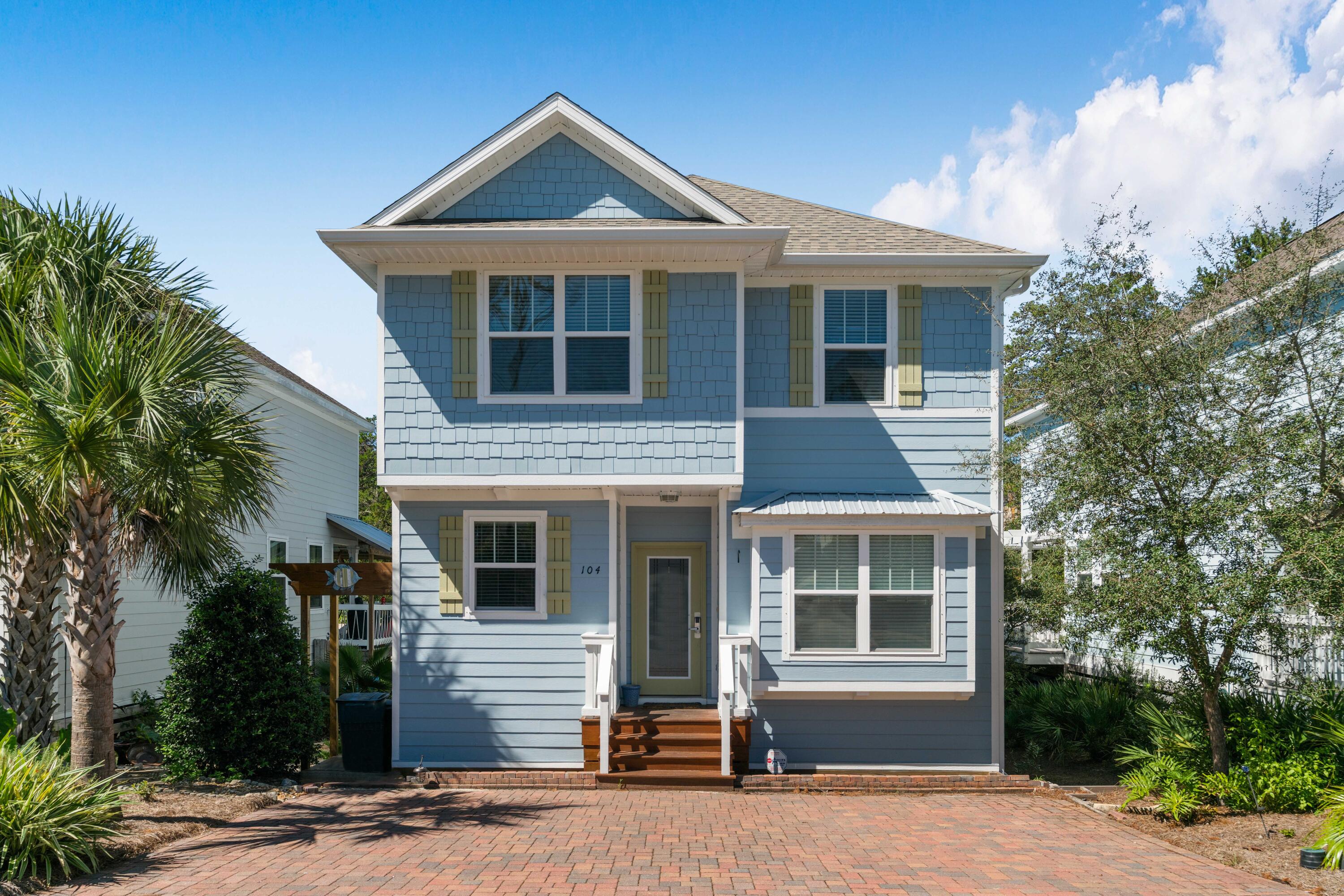 104 Sandpine Loop Inlet Beach, FL 32461 - Photo 2 of 26 a front view of a house with a yard