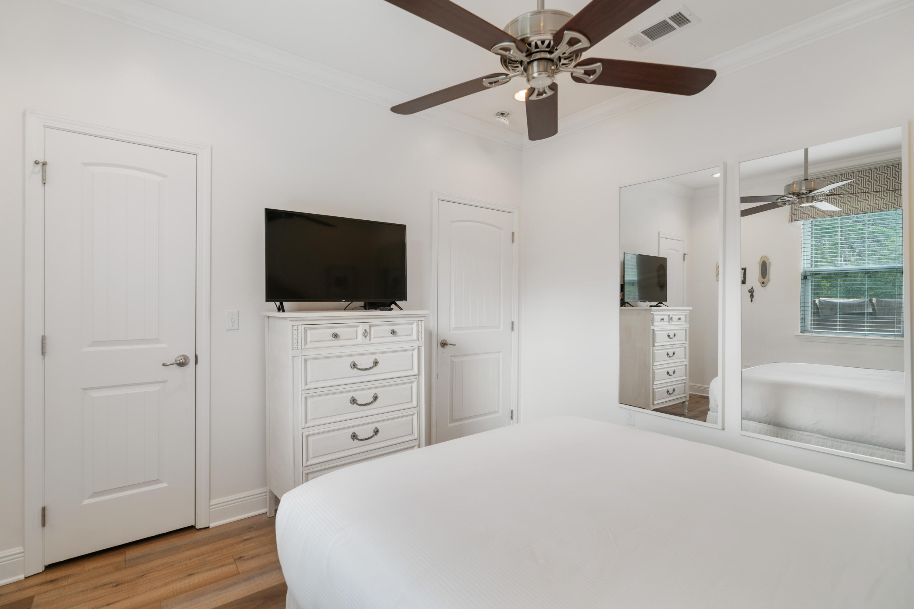 104 Sandpine Loop Inlet Beach, FL 32461 - Photo 21 of 26 a bedroom with a bed and a flat screen tv