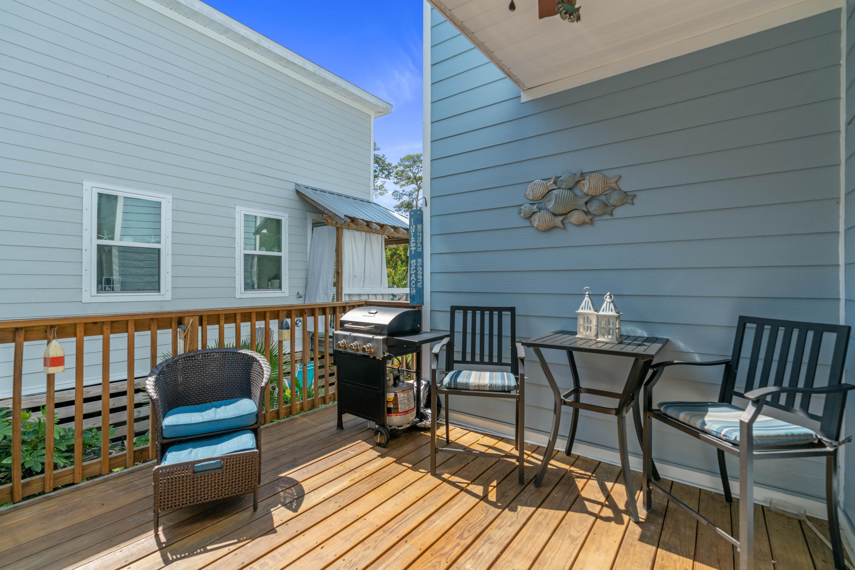104 Sandpine Loop Inlet Beach, FL 32461 - Photo 24 of 26 a view of a chairs and a table in the balcony