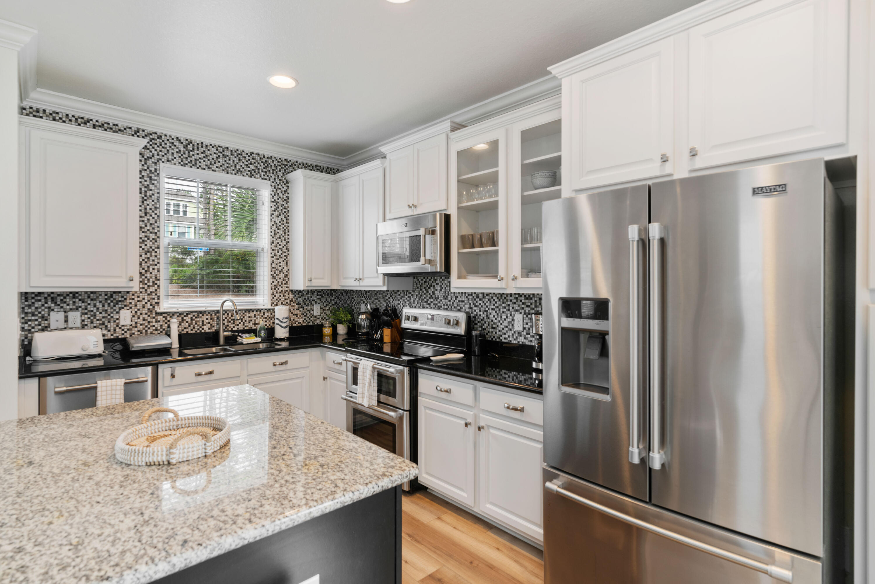 104 Sandpine Loop Inlet Beach, FL 32461 - Photo 8 of 26 a kitchen with a refrigerator a sink a stove and cabinets