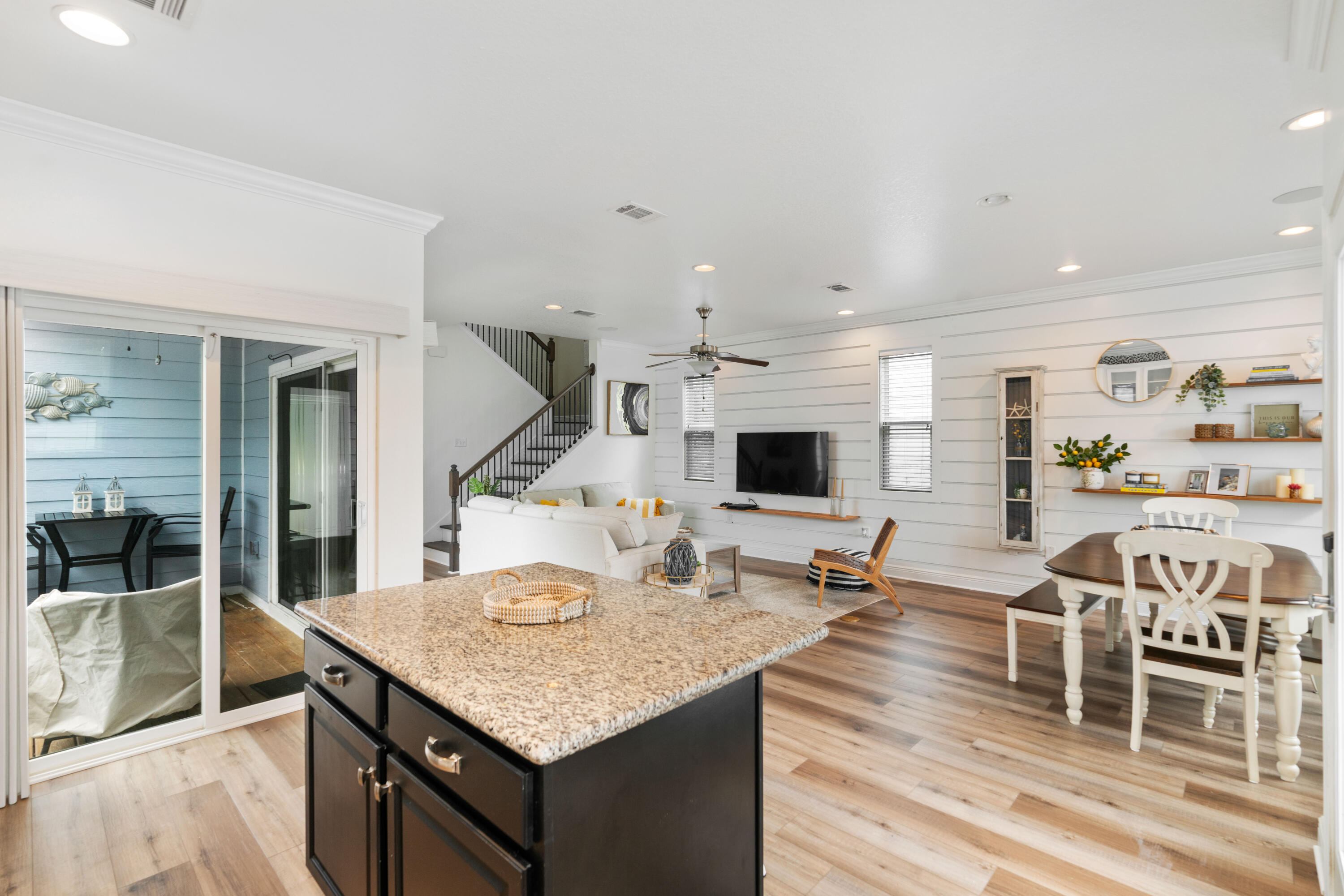 104 Sandpine Loop Inlet Beach, FL 32461 - Photo 10 of 26 a living room with stainless steel appliances kitchen island granite countertop a table chairs and a stove