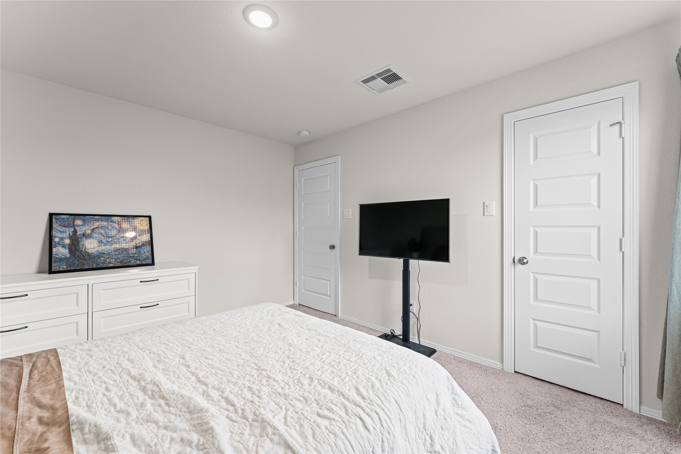 23326 Spring Genesis Lane Katy, TX 77493 - Photo 21 of 32 a bedroom with a bed and a flat screen tv