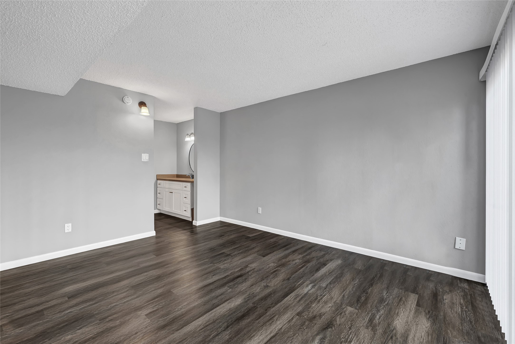 12111 Lemon Ridge Lane, Unit 121 Houston, TX 77035 - Photo 14 of 25 a view of an empty room with wooden floor