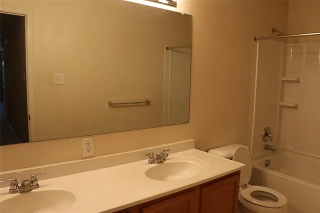 a bathroom with a tub and a shower