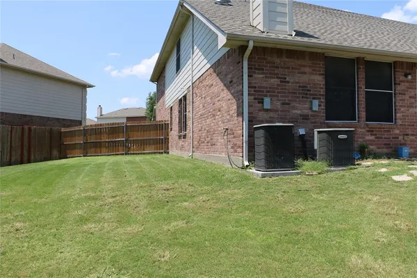 a front view of a house with yard