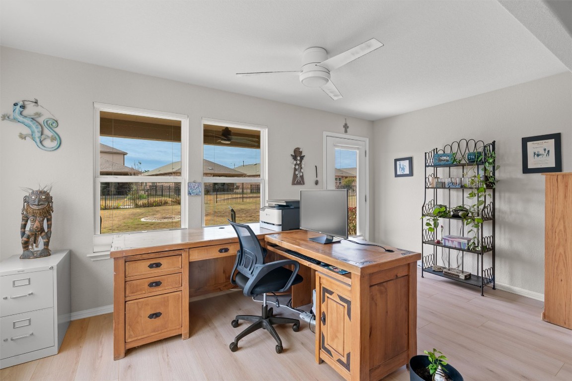 512 Rockport Street Georgetown, TX 78633 - Photo 13 of 26 a view of a workspace with furniture and a window