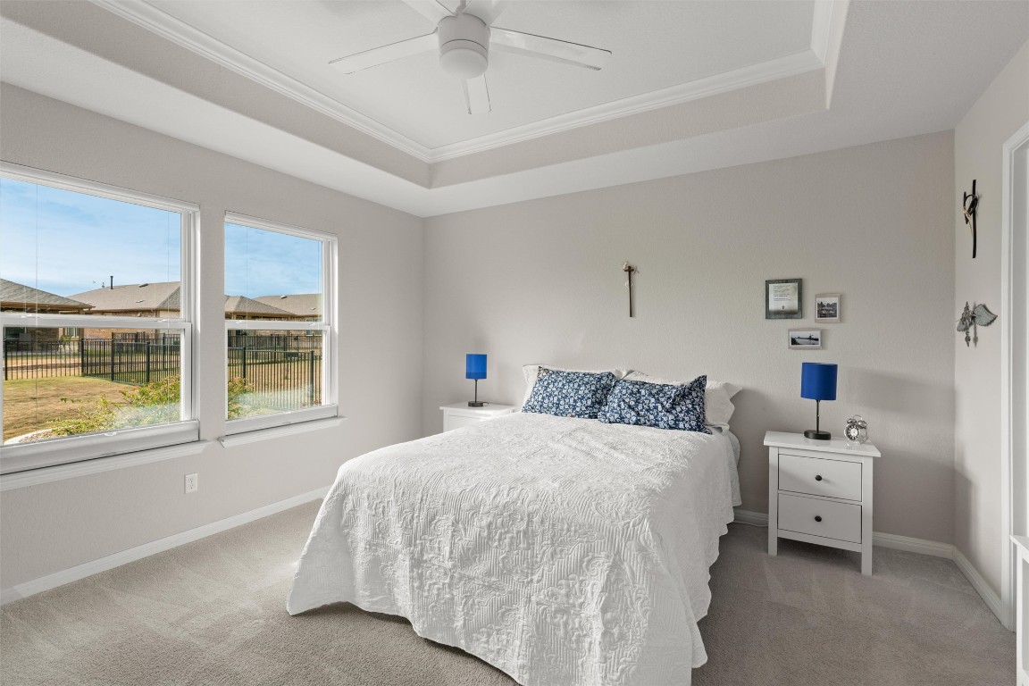 512 Rockport Street Georgetown, TX 78633 - Photo 14 of 26 a bedroom with a bed and a large window