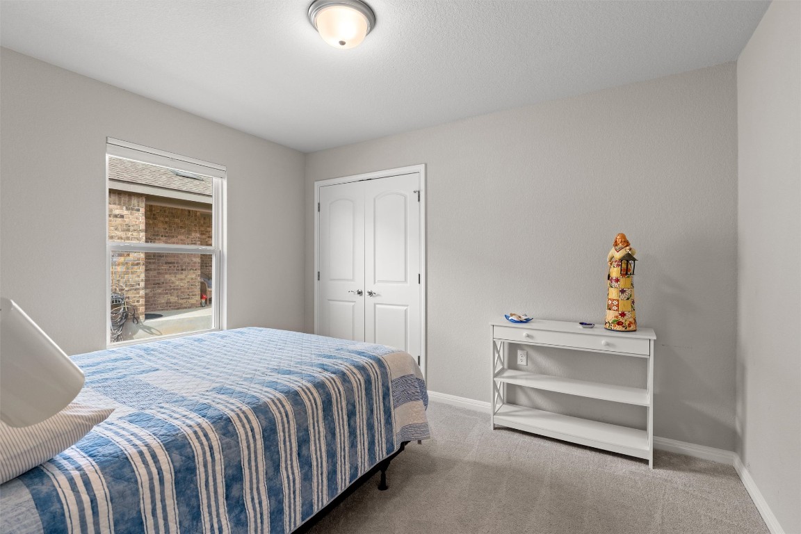 512 Rockport Street Georgetown, TX 78633 - Photo 18 of 26 a bedroom with a bed and a window
