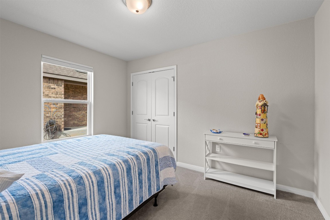 512 Rockport Street Georgetown, TX 78633 - Photo 19 of 26 a bedroom with a bed and a window