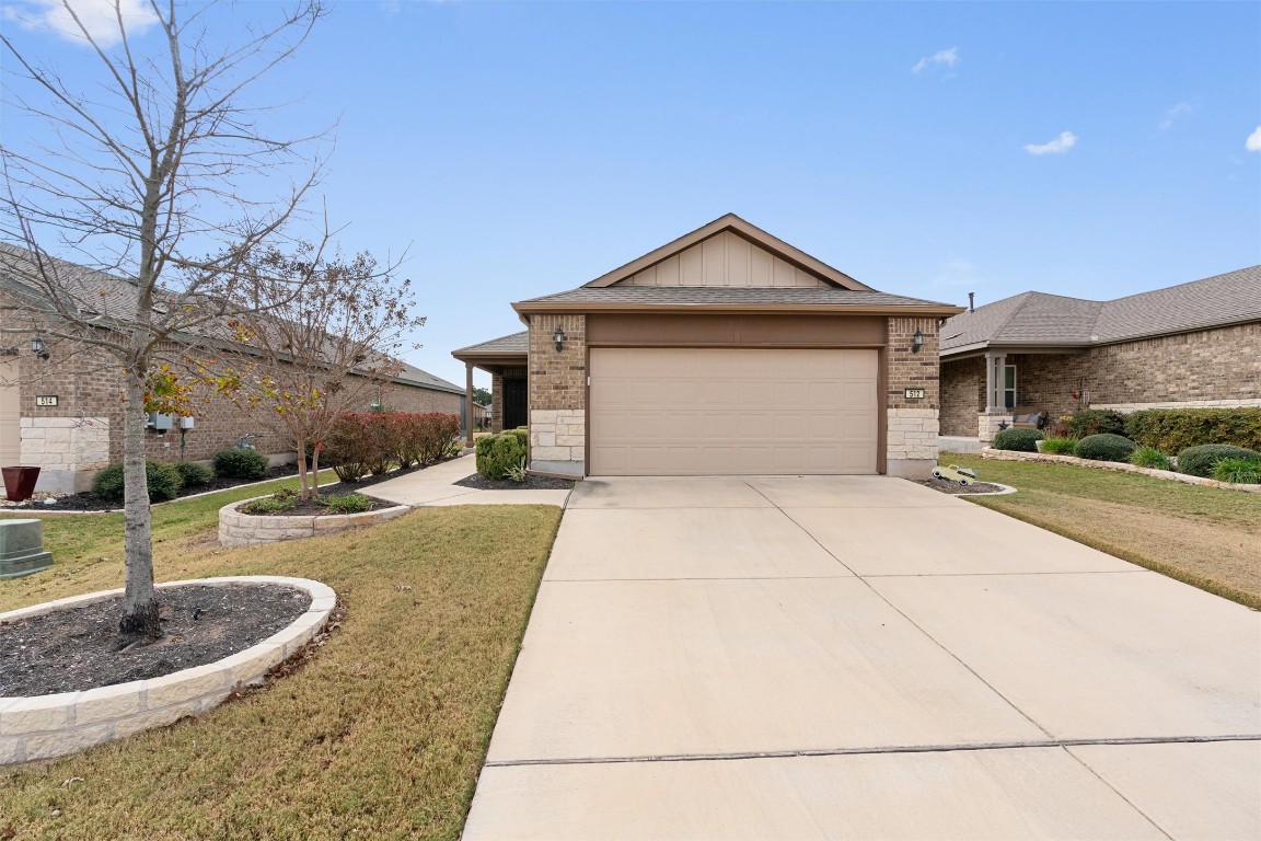 512 Rockport Street Georgetown, TX 78633 - Photo 2 of 26 a view of garage and yard