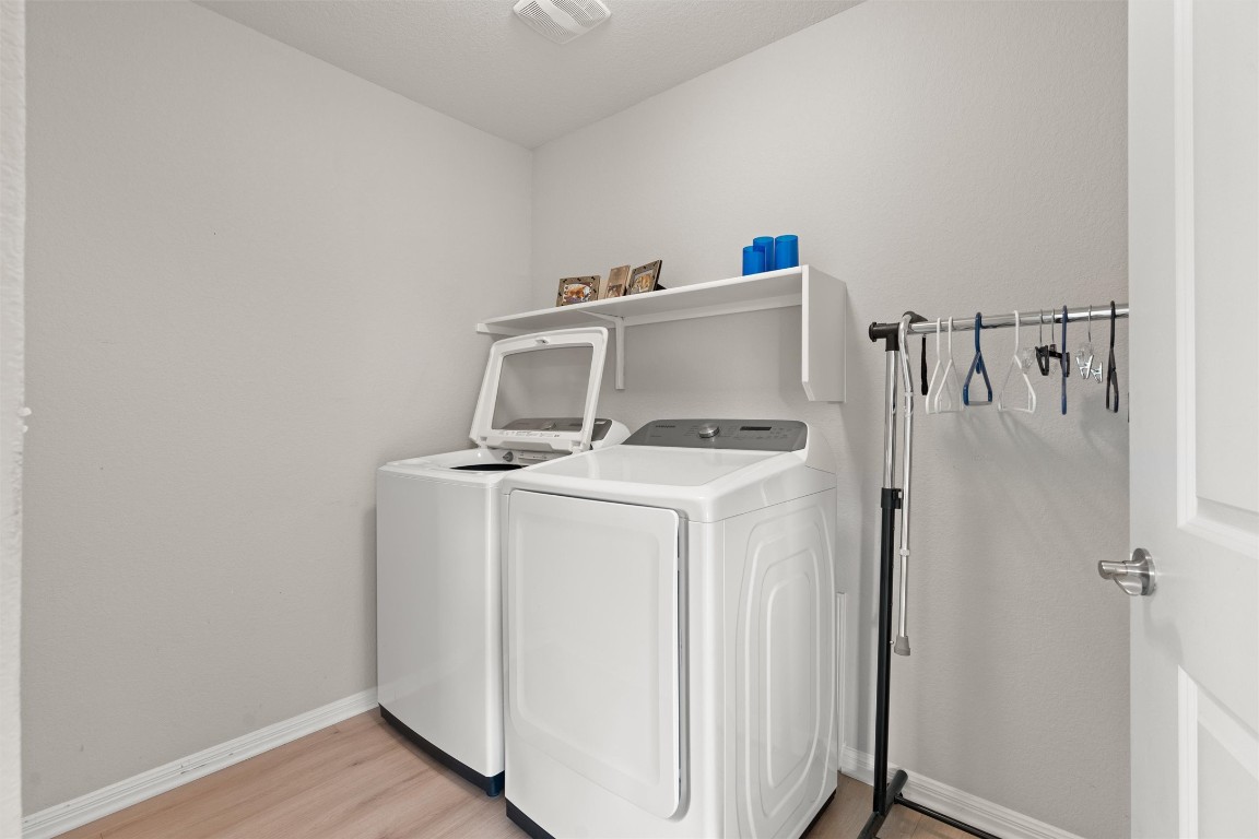 512 Rockport Street Georgetown, TX 78633 - Photo 22 of 26 a utility room with dryer and washer