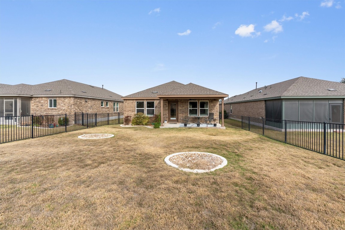 512 Rockport Street Georgetown, TX 78633 - Photo 25 of 26 a view of a house with swimming pool and a yard