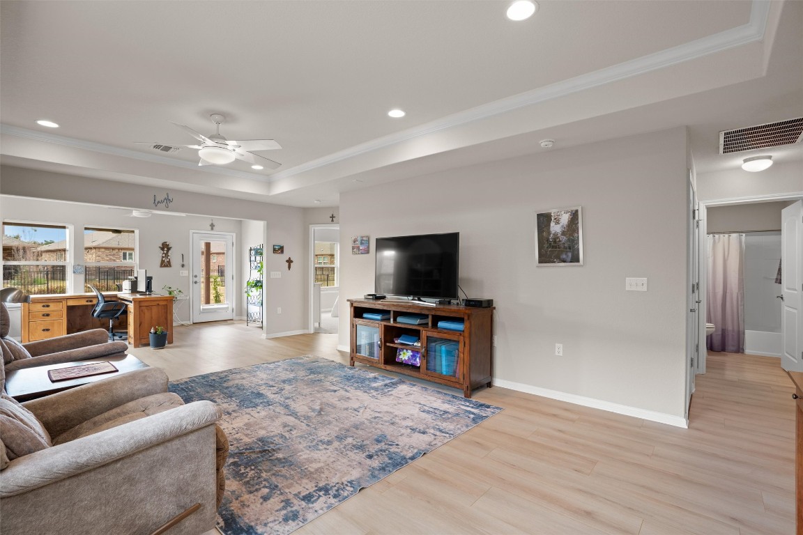 512 Rockport Street Georgetown, TX 78633 - Photo 9 of 26 a living room with furniture and a flat screen tv