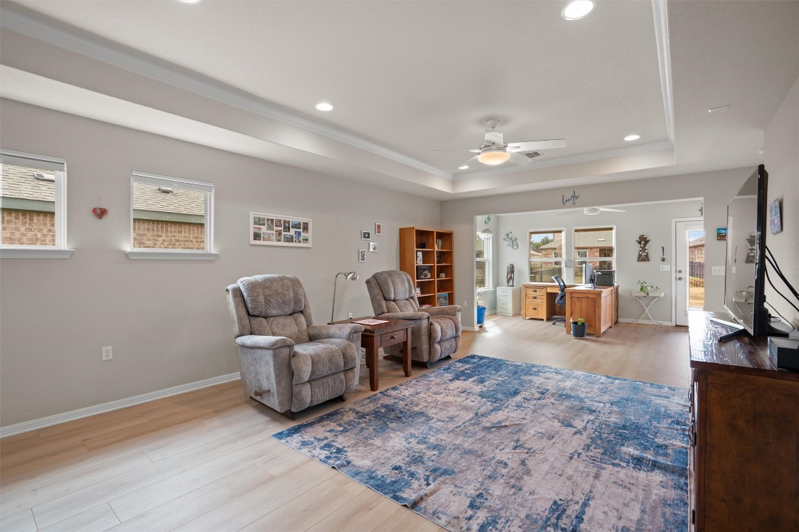 512 Rockport Street Georgetown, TX 78633 - Photo 10 of 26 a living room with furniture and a flat screen tv
