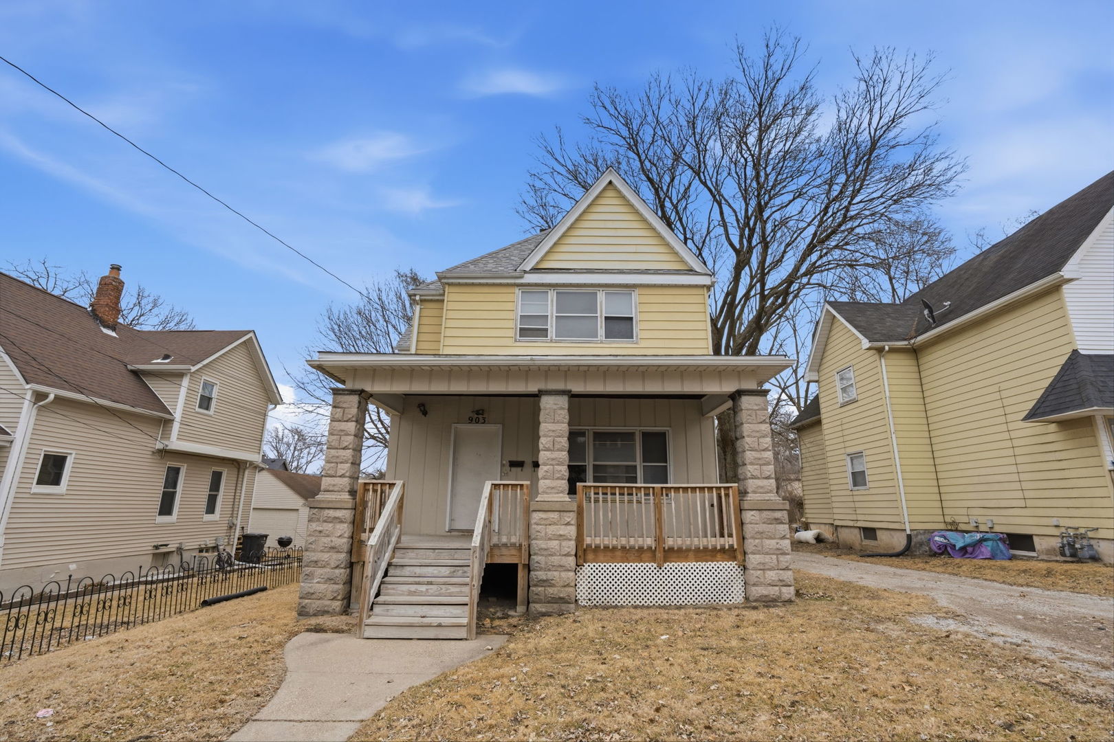 903 44th Street Rock Island, IL 61201 - Photo 1 of 28 a front view of a house with a porch
