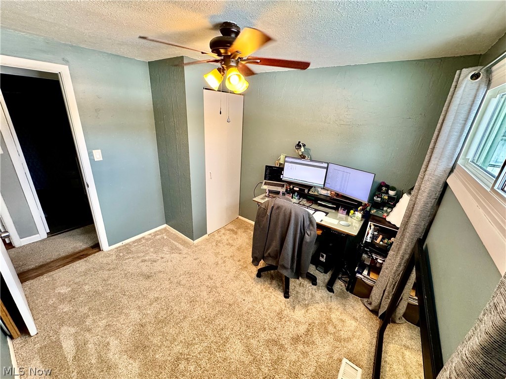 2852 Shelly Road Ravenna, OH 44266 - Photo 26 of 30 Carpeted office space featuring a textured ceiling and a ceiling fan