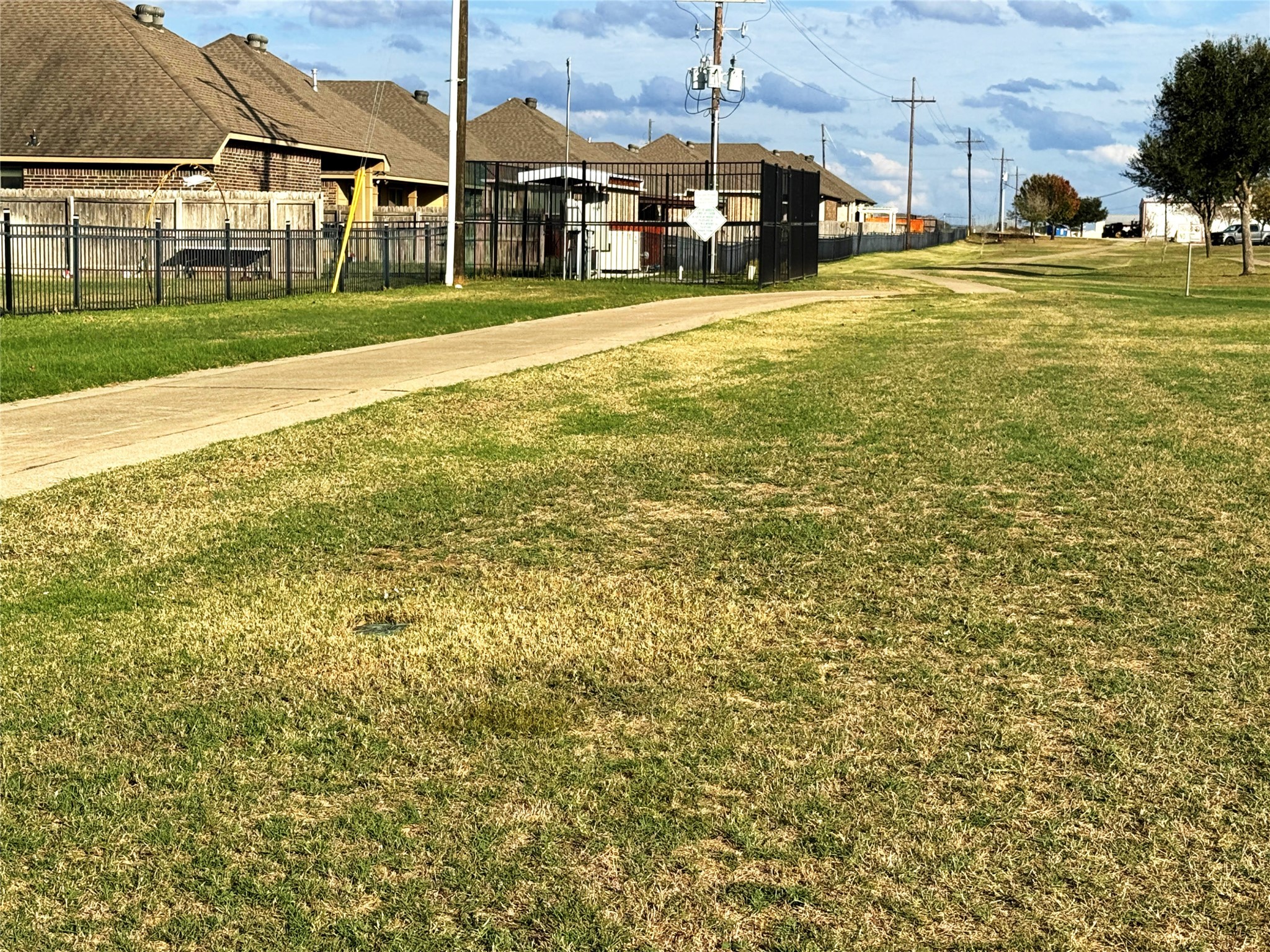 2001 Eagle View Drive Navasota, TX 77868 - Photo 9 of 9 a view of a swimming pool with a lawn chairs and a big yard