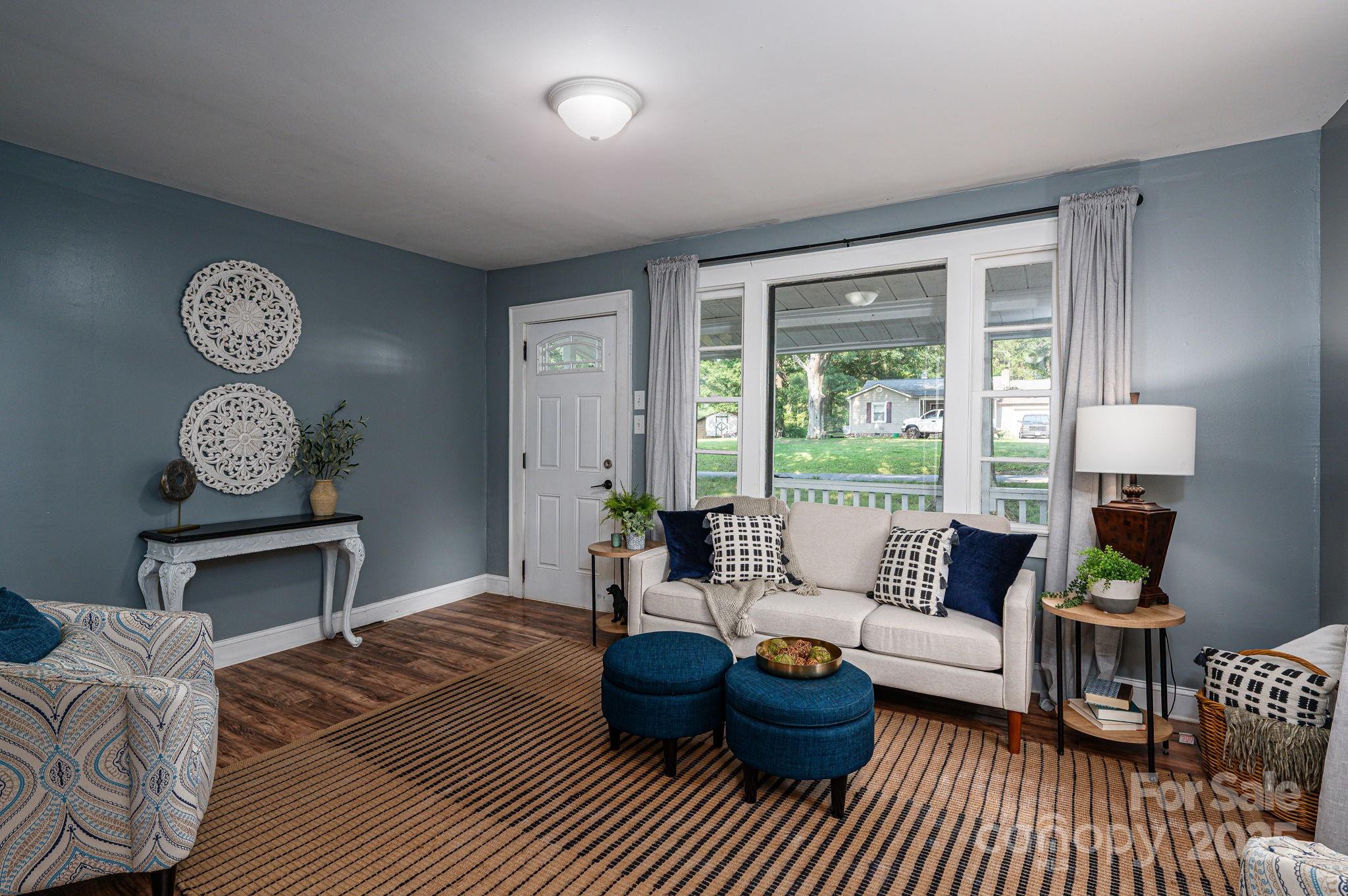 143 Hallman Street Cherryville, NC 28021 - Photo 11 of 31 a living room with furniture and a large window