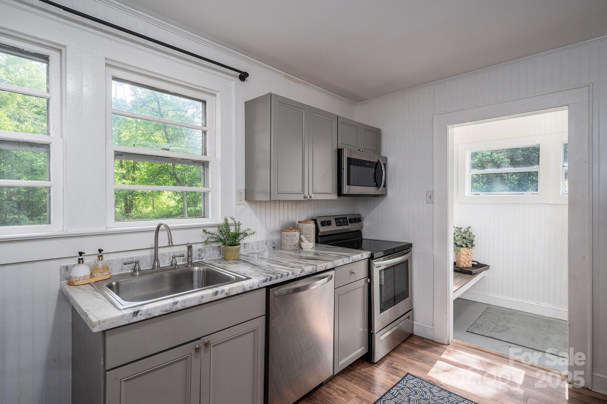 143 Hallman Street Cherryville, NC 28021 - Photo 15 of 31 a kitchen with a sink stove top oven and microwave