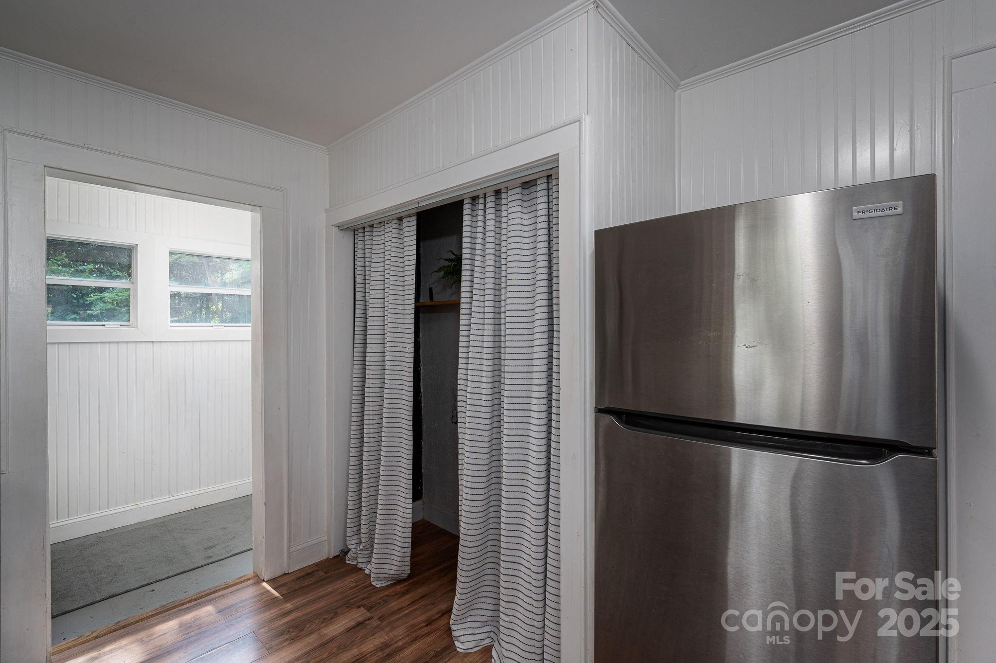 143 Hallman Street Cherryville, NC 28021 - Photo 16 of 31 a view of a refrigerator in kitchen and wooden floor