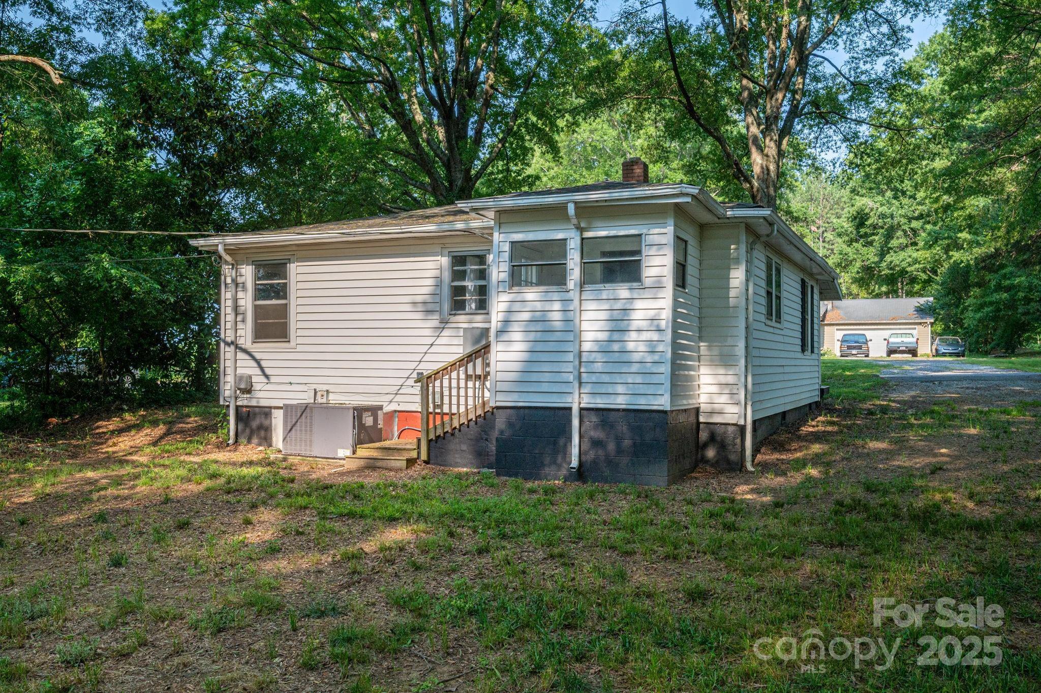 143 Hallman Street Cherryville, NC 28021 - Photo 27 of 31 a front view of a house with a yard and outdoor seating