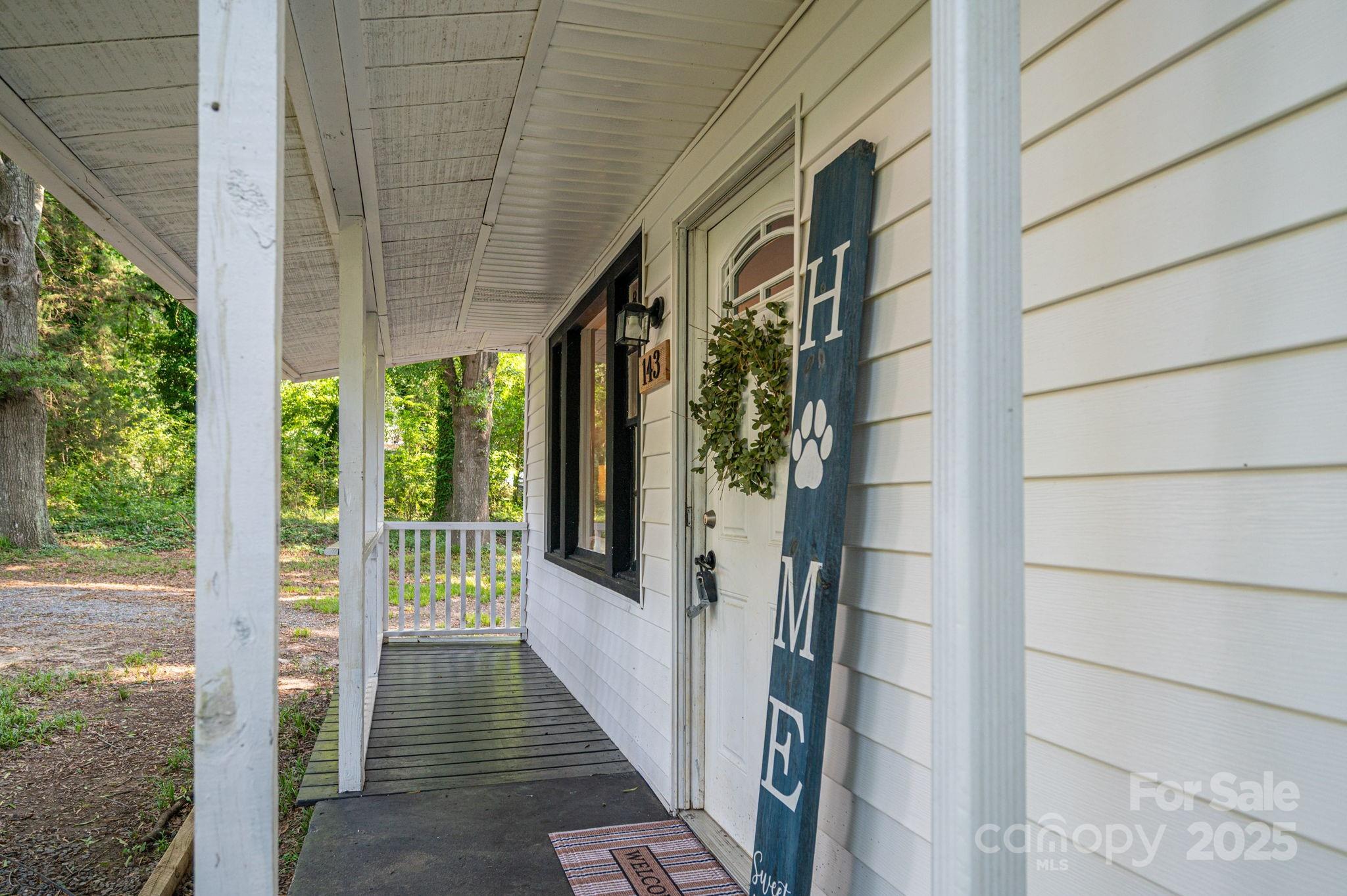 143 Hallman Street Cherryville, NC 28021 - Photo 6 of 31 a view of a porch with wooden floor and stairs