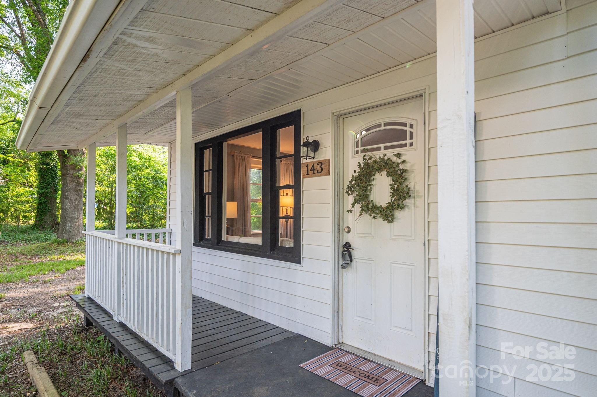 143 Hallman Street Cherryville, NC 28021 - Photo 7 of 31 a view of a porch with wooden floor and stairs