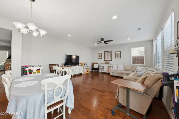 a living room with fireplace furniture and a flat screen tv