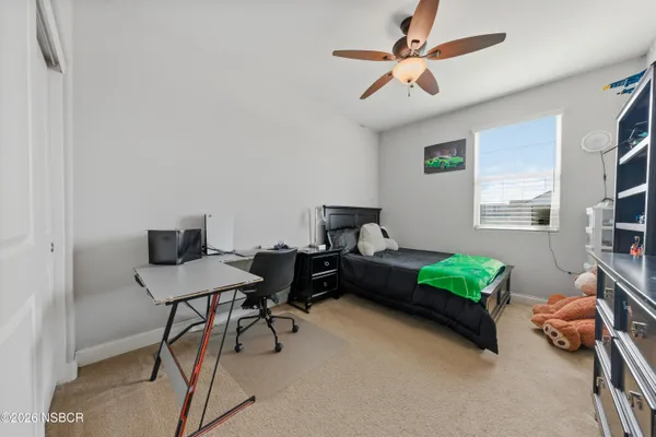 a livingroom with workspace and a window