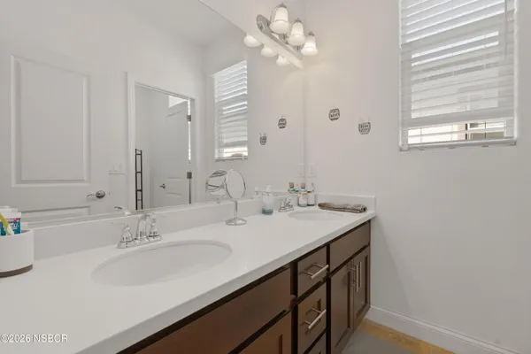a bathroom with a sink a vanity and a mirror