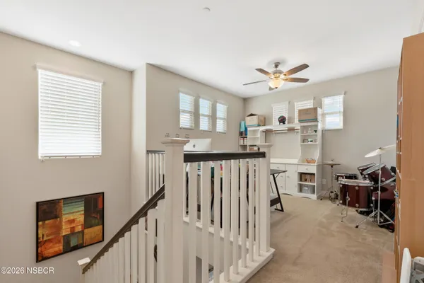 a view of a livingroom with furniture and windows