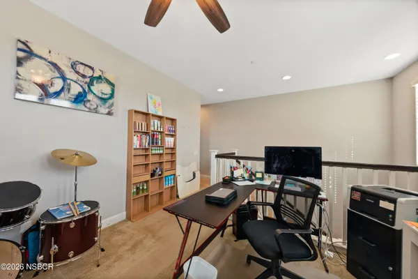 a view of a workspace with furniture