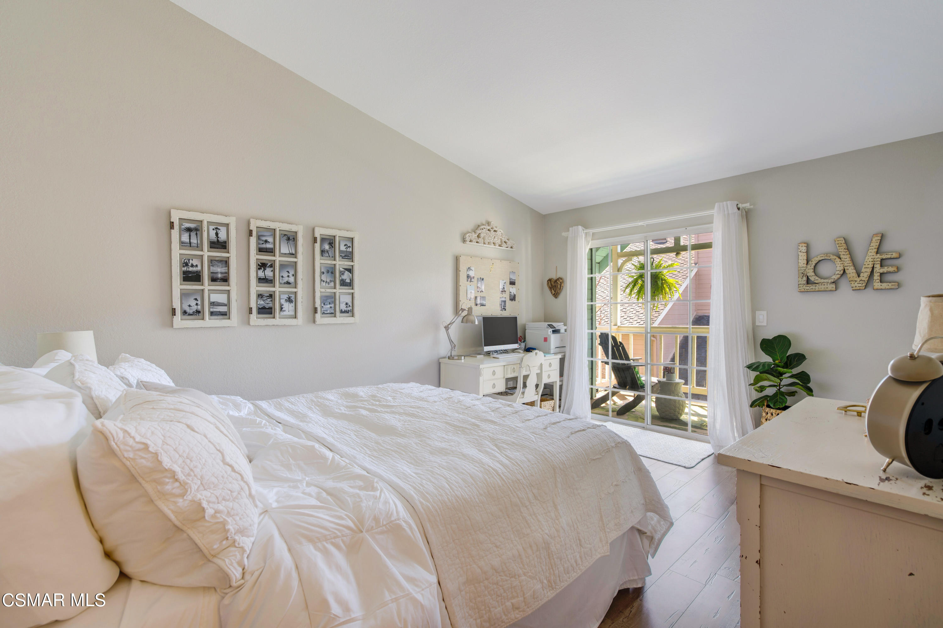 1948 Rory Lane, Unit 4 Simi Valley, CA 93063 - Photo 15 of 23 a bedroom with a bed window and table