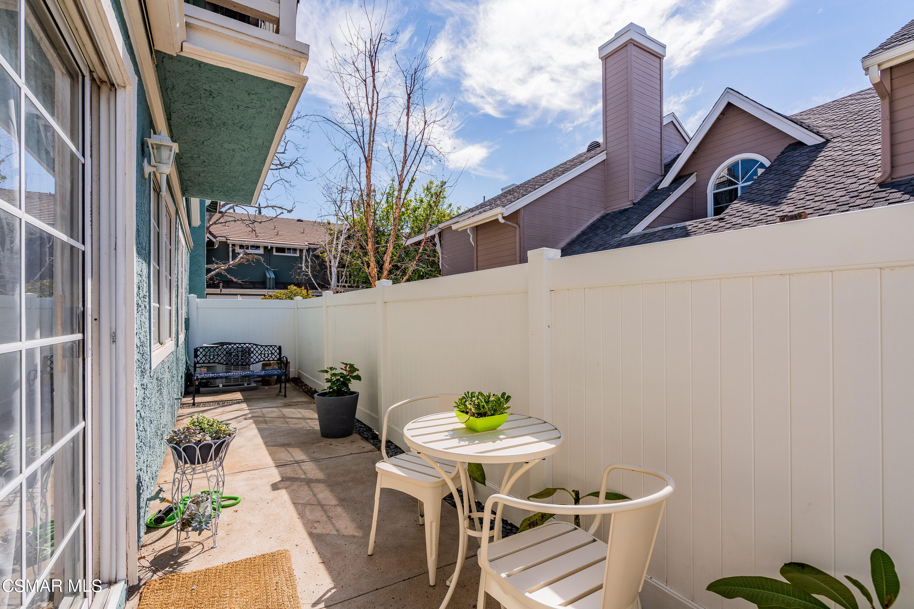 1948 Rory Lane, Unit 4 Simi Valley, CA 93063 - Photo 23 of 23 a backyard of a house with table and chairs