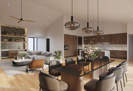 a living room with furniture kitchen and a chandelier