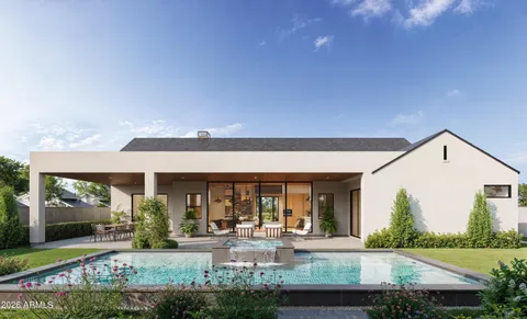 a view of house with swimming pool and outdoor seating